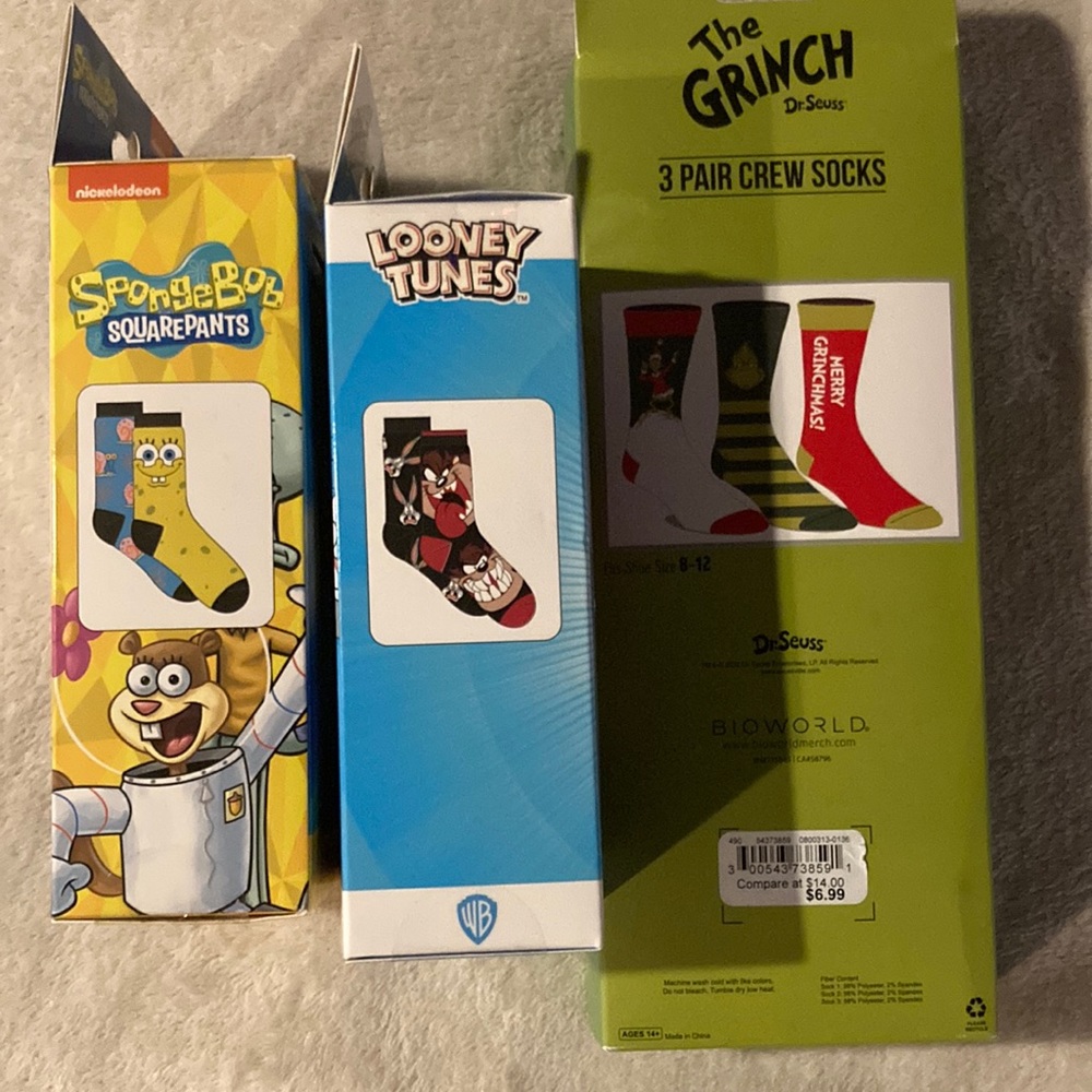 3 pairs of grinch socks. 2 pairs of looney tunes socks. 2 pairs SpongeBob socks